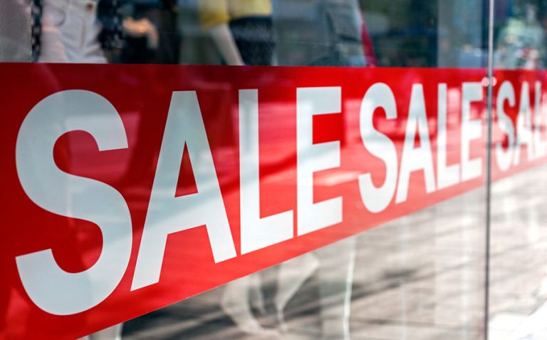sale sign in store window